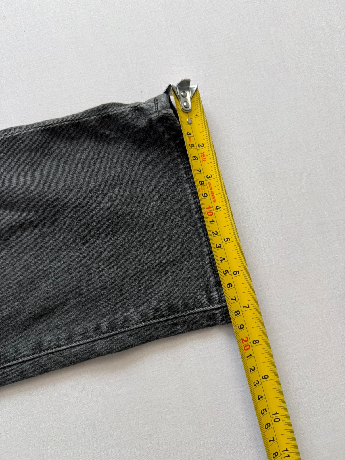 Levi's grey black slim fit jeans with classic five-pocket styling and back arcuate stitching.