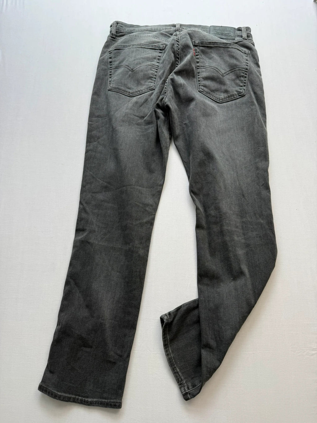 Levi's grey black slim fit jeans with classic five-pocket styling and back arcuate stitching.