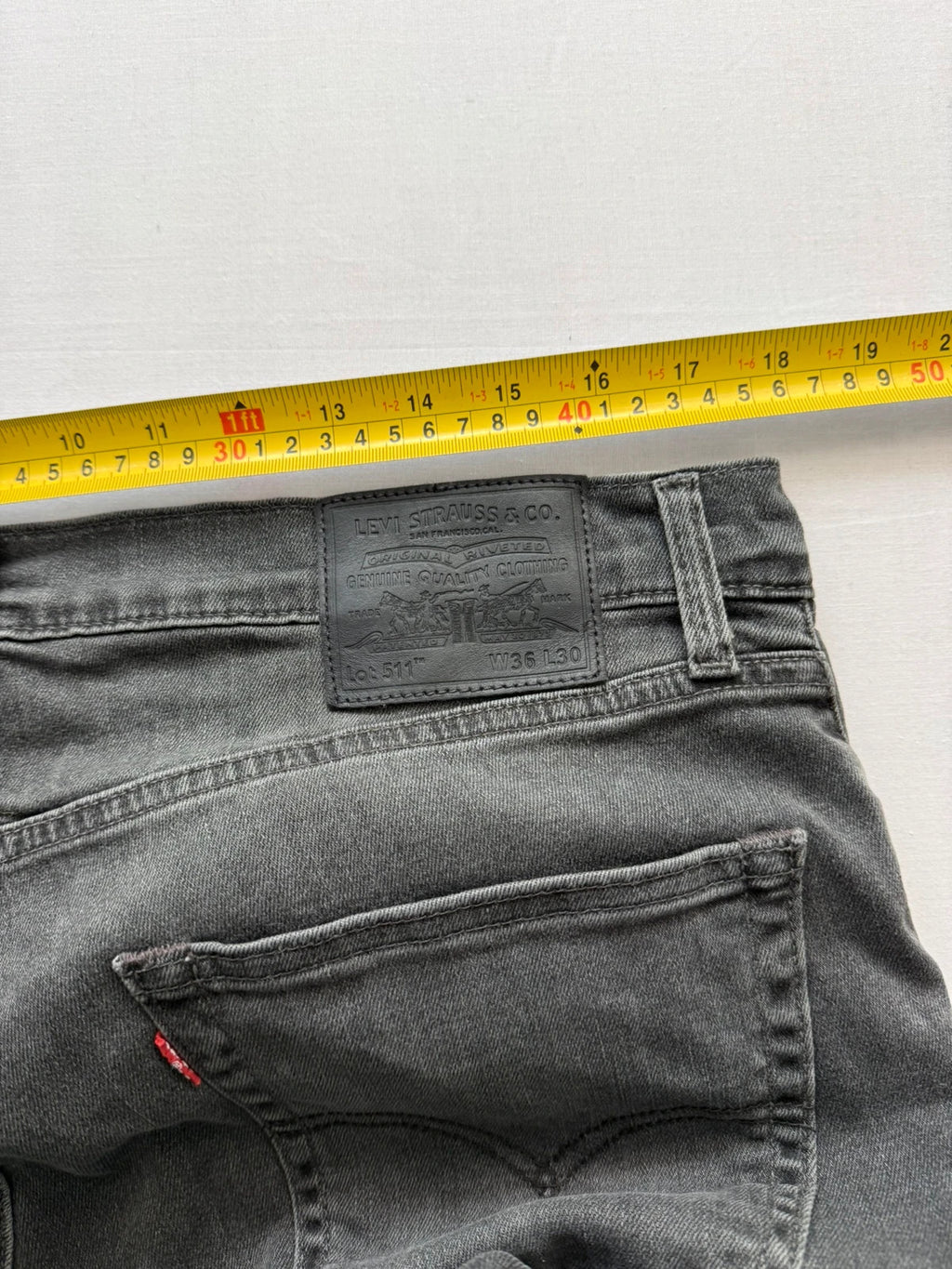 Levi's grey black slim fit jeans with classic five-pocket styling and back arcuate stitching.
