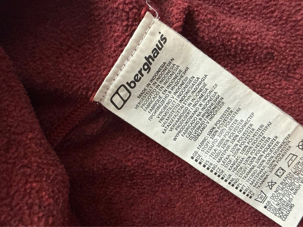 Berghaus burgundy quarter zip fleece with zip chest pocket and adjustable drawcord hem.