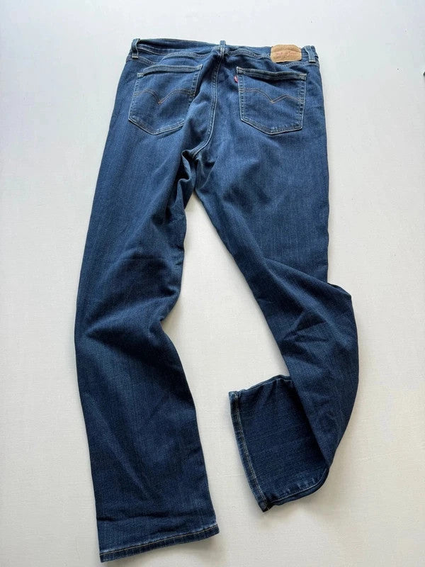 Levi's mid blue straight jeans with classic five-pocket styling and comfortable stretch fit.