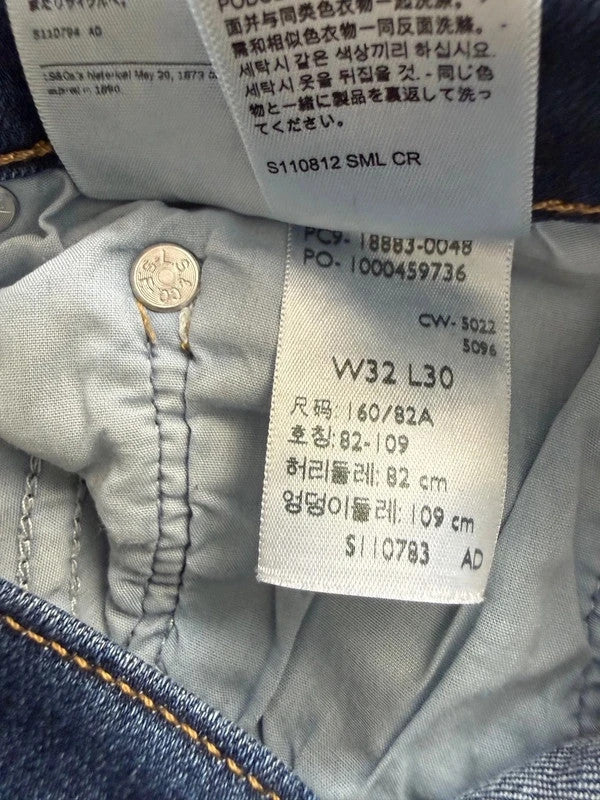 Levi's mid blue straight jeans with classic five-pocket styling and comfortable stretch fit.