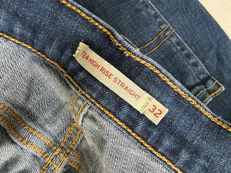 Levi's mid blue straight jeans with classic five-pocket styling and comfortable stretch fit.
