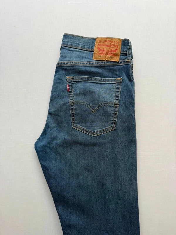 Levi's blue straight jeans with slim tapered fit and zip fly closure.