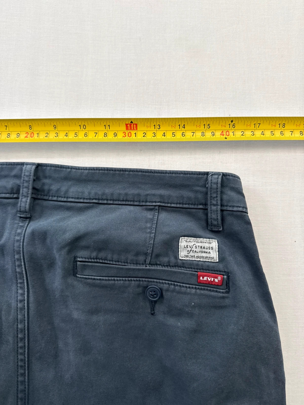 Levi's grey chino trousers slim tapered fit with red tab and slanted pockets.