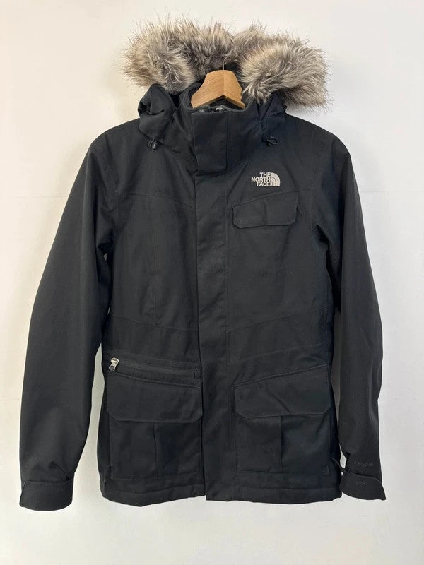 The North Face black ski jacket with faux fleece-lined hood and multiple pockets.