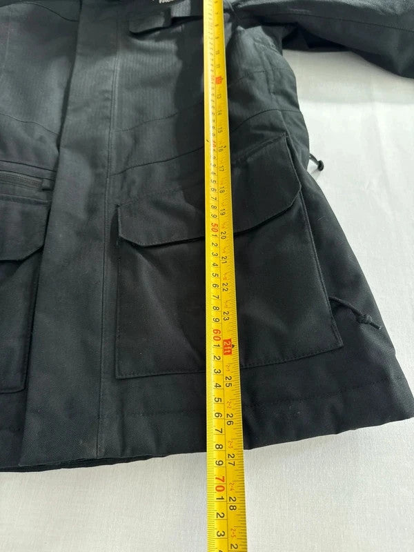 The North Face black ski jacket with faux fleece-lined hood and multiple pockets.
