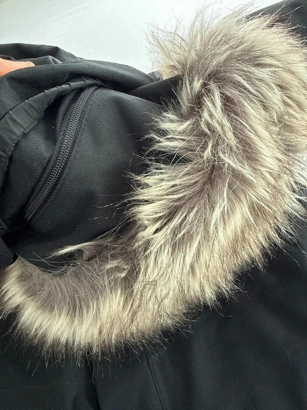 The North Face black ski jacket with faux fleece-lined hood and multiple pockets.