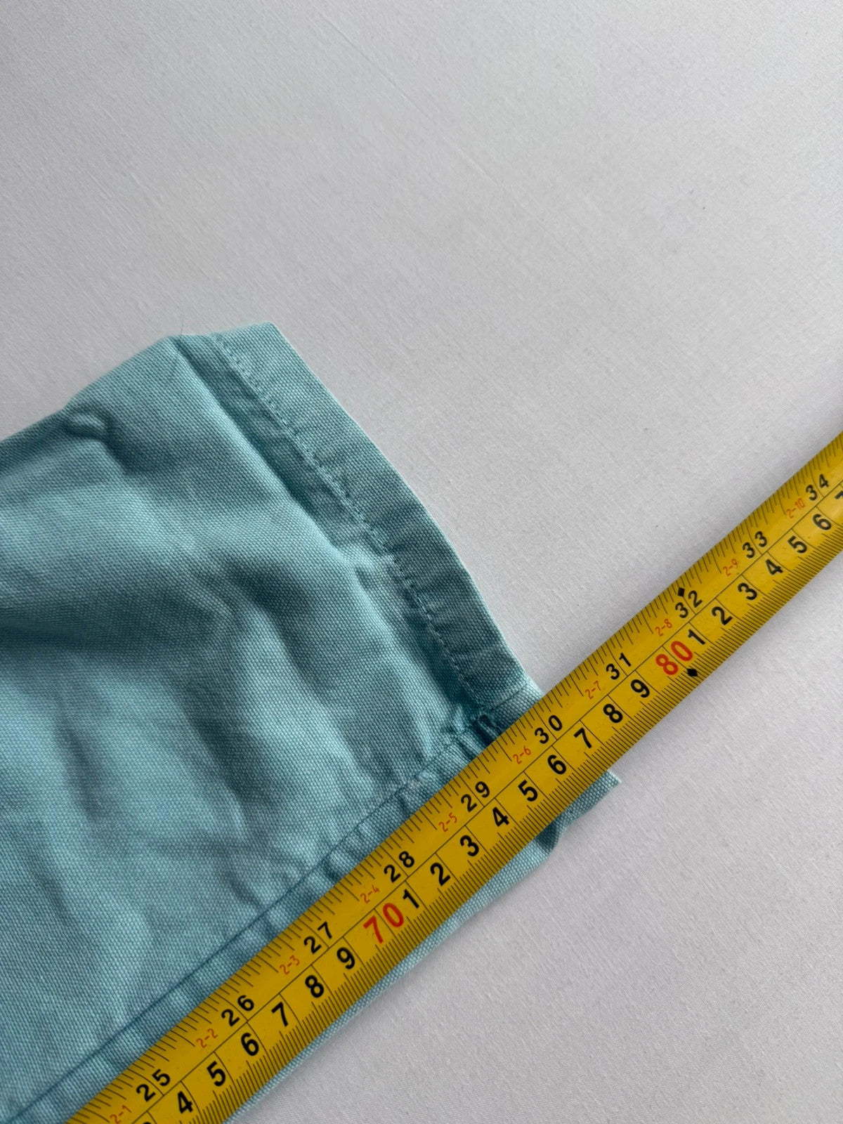 Lucy & Yak light blue dungarees with tie-up straps and large bib pocket, organic cotton.