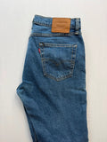 Levi's blue straight jeans with leather back patch and red tab detail.