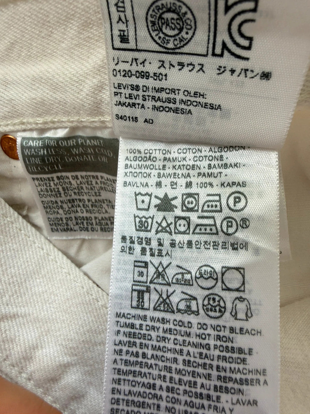 Levi's cream high rise skinny jeans with button fly and rigid cotton denim.